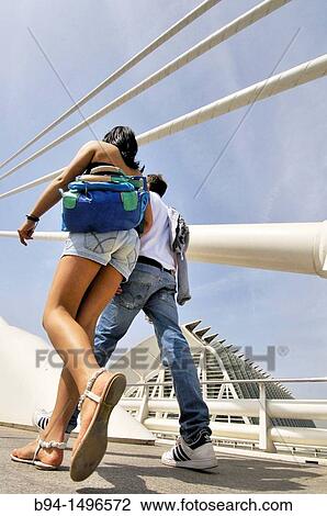 Couple walking on l? Assut de l? Or bridge, City of Arts and Sciences by Santiago Calatrava, Valencia. Comunidad Valenciana, Spain View Large Photo Image Stock Image - Couple walking on l? Assut de l? Or bridge, City of Arts and Sciences by Santiago Calatrava, Valencia. Comunidad Valenciana, Spain. Fotosearch