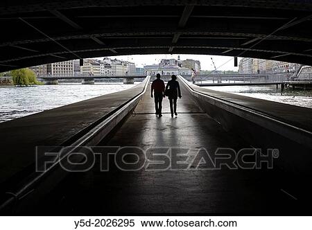 Couple walking on passage under the Mont Blanc bridge, Rhone river, Geneva, Switzerland View Large Photo Image Stock Photography - Couple walking on passage under the Mont Blanc bridge, Rhone river, Geneva, Switzerland. Fotosearch
