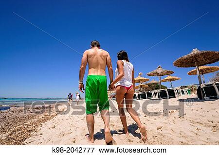 couple walking on the beach, beach Es Trenc. Mallorca. Balearic Islands. Spain. View Large Photo Image Stock Photo - couple walking on the beach, beach Es Trenc. Mallorca. Balearic Islands. Spain.. Fotosearch