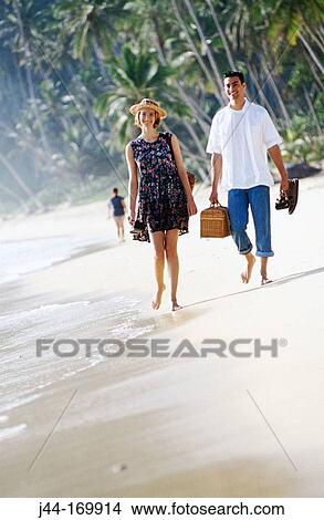Couple walking on the beach. Venezuela View Large Photo Image Picture - Couple walking on the beach. Venezuela. Fotosearch
