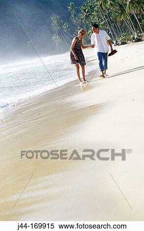 Couple walking on the beach. Venezuela View Large Photo Image Stock Photography - Couple walking on the beach. Venezuela. Fotosearch