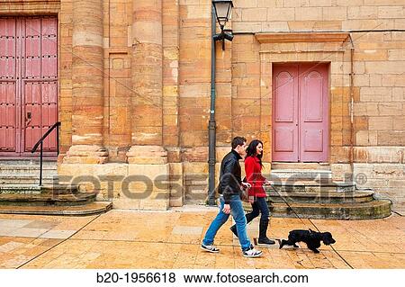 Couple walking with dog, Constitution square, Oviedo, Asturias, Spain. View Large Photo Image Stock Photo - Couple walking with dog, Constitution square, Oviedo, Asturias, Spain.. Fotosearch