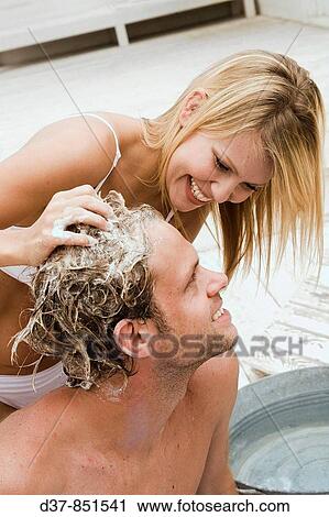 Couple washing hair View Large Photo Image Stock Image - Couple washing hair. Fotosearch