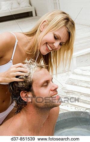 Couple washing hair View Large Photo Image Stock Photo - Couple washing hair. Fotosearch