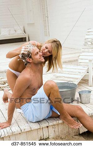 Couple washing hair View Large Photo Image Stock Photography - Couple washing hair. Fotosearch
