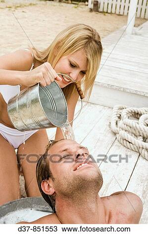 Couple washing hair with affection View Large Photo Image Stock Image - Couple washing hair with affection. Fotosearch