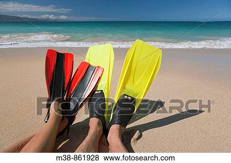 Couple wearing flippers on the beach Maui, Hawaii View Large Photo Image Stock Photo - Couple wearing flippers on the beach Maui, Hawaii. Fotosearch