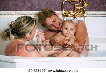 couple with baby in bath tub View Large Photo Image Stock Photo - couple with baby in bath tub. Fotosearch