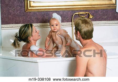 couple with baby in bath tub View Large Photo Image Stock Photo - couple with baby in bath tub. Fotosearch