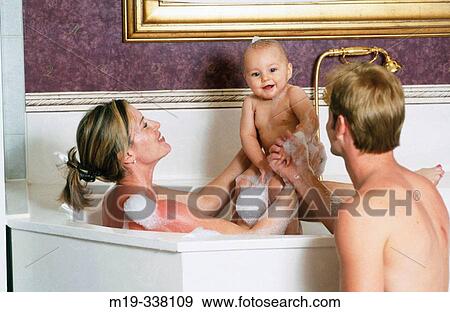 couple with baby in bath tub View Large Photo Image Stock Photo - couple with baby in bath tub. Fotosearch