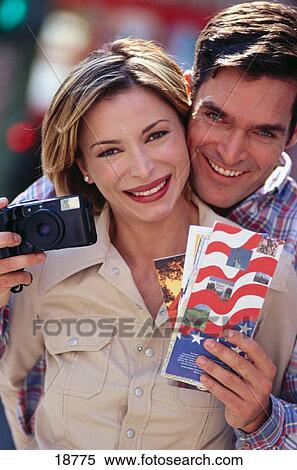 Couple with camera View Large Photo Image Stock Photography - Couple with camera. Fotosearch