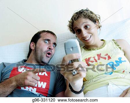 Couple with cell phone View Large Photo Image Stock Image - Couple with cell phone. Fotosearch