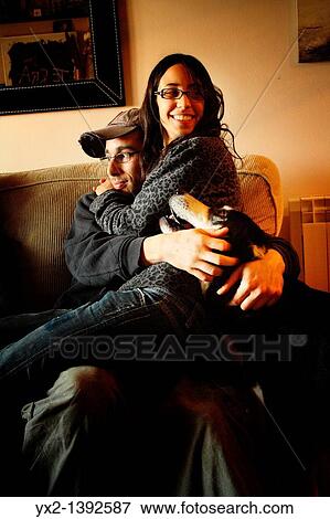 Couple with dog at home View Large Photo Image Stock Photo - Couple with dog at home. Fotosearch