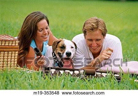 Couple with dog playing backgammon View Large Photo Image Stock Photo - Couple with dog playing backgammon. Fotosearch