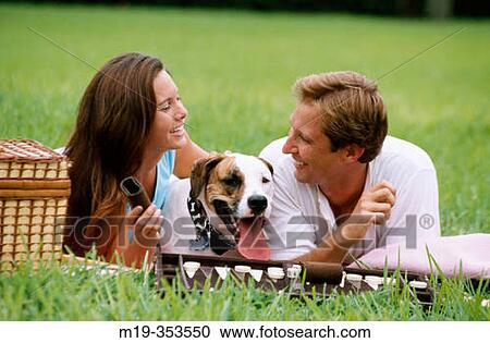 Couple with dog View Large Photo Image Stock Image - Couple with dog. Fotosearch
