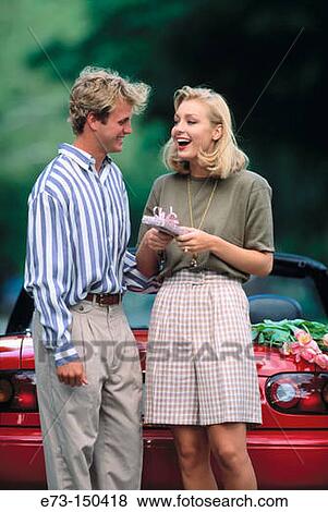 Couple with gift View Large Photo Image Stock Photo - Couple with gift. Fotosearch