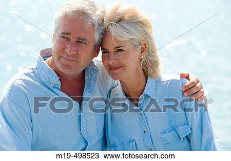 couple with man's arm around the woman View Large Photo Image Stock Image - couple with man's arm around the woman. Fotosearch