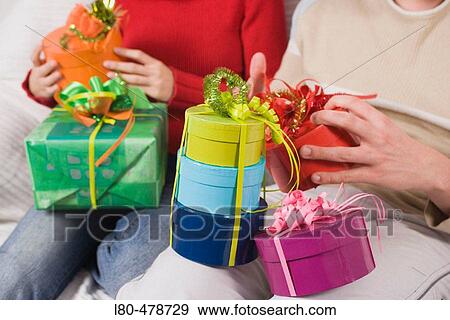 Couple with parcels View Large Photo Image Stock Photo - Couple with parcels. Fotosearch