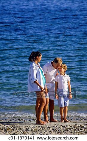 Couple with pregnant woman and boy on beach View Large Photo Image Stock Image - Couple with pregnant woman and boy on beach. Fotosearch