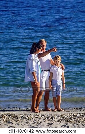 Couple with pregnant woman and boy on seashore View Large Photo Image Stock Image - Couple with pregnant woman and boy on seashore. Fotosearch