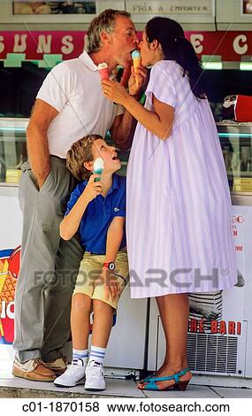Couple with pregnant woman and boy eating ice creams View Large Photo Image Stock Photo - Couple with pregnant woman and boy eating ice creams. Fotosearch