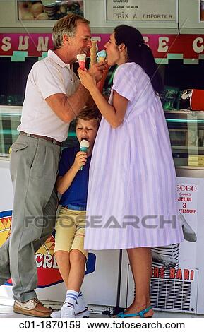 Couple with pregnant woman and boy eating ice creams View Large Photo Image Stock Photo - Couple with pregnant woman and boy eating ice creams. Fotosearch