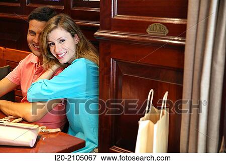 Stock Photo - Couple with shopping bags in a coffee bar. San Sebastian. Donostia. Gipuzkoa. Basque Country. Spain.. Fotosearch
