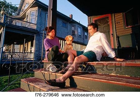 Couple with yellow lab puppy View Large Photo Image Stock Photograph - Couple with yellow lab puppy. Fotosearch