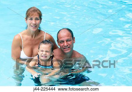 Picture - Couple with young girl in the pool. Fotosearch
