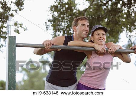 Couple working out together View Large Photo Image Stock Photograph - Couple working out together. Fotosearch