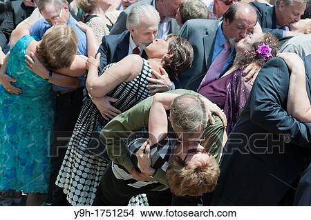 Couples re-enact the famous V-Day kiss outside Madison Square Garden for a group photograph celebrating the 30th anniversary of the Rev Sun Myung Moon's mass wedding View Large Photo Image Picture - Couples re-enact the famous V-Day kiss outside Madison Square Garden for a group photograph celebrating the 30th anniversary of the Rev Sun Myung Moon's mass wedding . Fotosearch