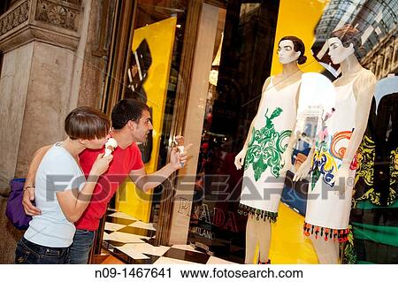 Stock Image - couples who are shopping in Milan. Fotosearch