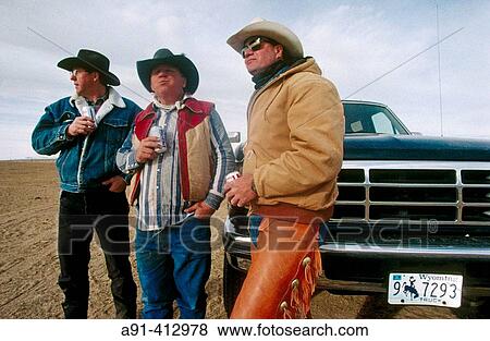 Cow boys from the Flitner ranch in Greybull during a calf tagging. Wyoming. USA. View Large Photo Image Stock Photo - Cow boys from the Flitner ranch in Greybull during a calf tagging. Wyoming. USA.. Fotosearch