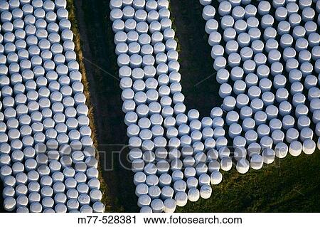 Stock Image - Cow food in plastic, aerial view. N? rke, Sweden. Fotosearch