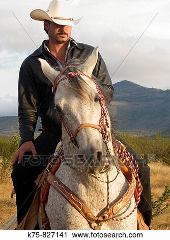 Stock Image - Cowboy and his horse, San Miguel de Allende. Fotosearch