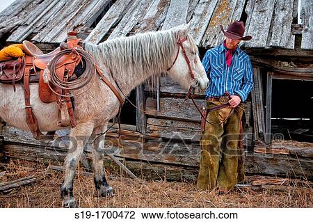 cowboy and horse at the cabin View Large Photo Image Stock Image - cowboy and horse at the cabin. Fotosearch