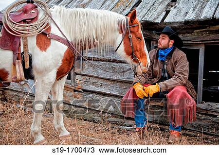 cowboy and horse at the cabin View Large Photo Image Stock Image - cowboy and horse at the cabin. Fotosearch