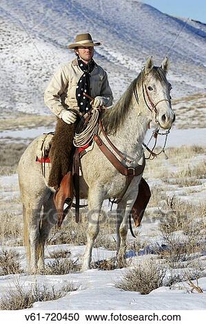 Cowboy out for a ride in winter, Shell, Wyoming. Usa View Large Photo Image Stock Image - Cowboy out for a ride in winter, Shell, Wyoming. Usa. Fotosearch