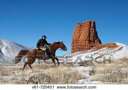 Cowboy out for a ride in winter, Shell, Wyoming. Usa View Large Photo Image Stock Image - Cowboy out for a ride in winter, Shell, Wyoming. Usa. Fotosearch