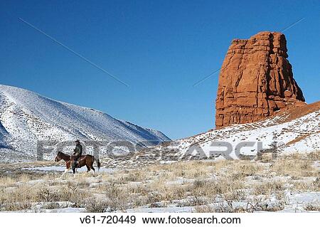 Cowboy out for a ride in winter, Shell, Wyoming. Usa View Large Photo Image Stock Photo - Cowboy out for a ride in winter, Shell, Wyoming. Usa. Fotosearch