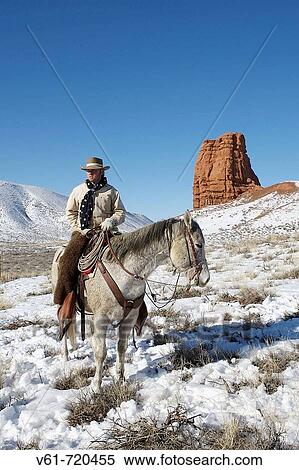 Cowboy out for a ride in winter, Shell, Wyoming. Usa View Large Photo Image Stock Photography - Cowboy out for a ride in winter, Shell, Wyoming. Usa. Fotosearch
