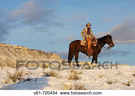 Cowboy out for a winter ride, Shell, Wyoming. Usa View Large Photo Image Picture - Cowboy out for a winter ride, Shell, Wyoming. Usa. Fotosearch