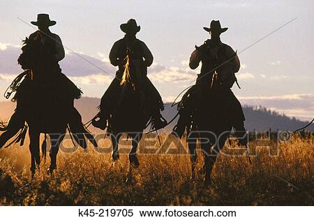 Stock Photography - Cowboy silhouettes. Ponderosa Ranch. Central Oregon. USA. Fotosearch