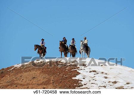 Stock Photo - Cowboys out for a ride in winter, Shell, Wyoming. Usa. Fotosearch