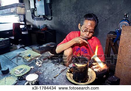 Picture - Craftman working with silver Yogyakarta Java Indonesia. Fotosearch