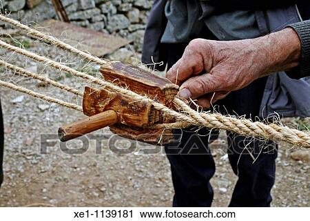 Craftsman building a wicker rope. View Large Photo Image Stock Image - Craftsman building a wicker rope.. Fotosearch