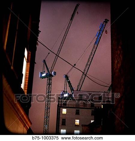 Cranes and buildings View Large Photo Image Stock Photography - Cranes and buildings. Fotosearch