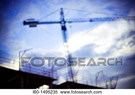 Cranes working View Large Photo Image Stock Photography - Cranes working. Fotosearch