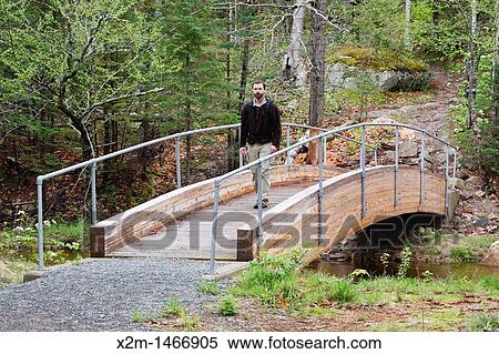 Stock Photography - Crawford Notch State Park - Male hiker along the Appalachian Trail Webster Cliff Trail in the White Mountains, New Hampshire USA. Fotosearch