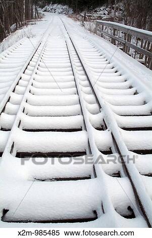 Crawford Notch State Park - Snow covered railroad bridge along the Maine Central Railroad near Ethan Pond Trail in the White Mountains, New Hampshire USA The old Willey House Station site is off in the distance on the right View Large Photo Image Stock Photography - Crawford Notch State Park - Snow covered railroad bridge along the Maine Central Railroad near Ethan Pond Trail in the White Mountains, New Hampshire USA The old Willey House Station site is off in the distance on the right. Fotosearch